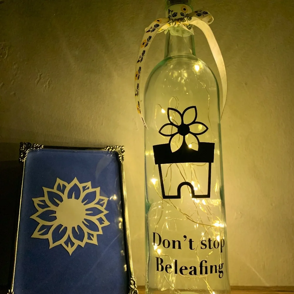 ‘Don’t Stop Beleafing’ logo wine bottle lantern